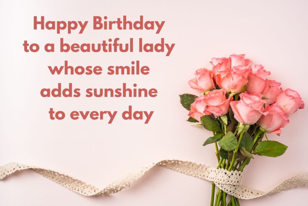 A bouquet of fresh pink roses with green leaves tied together with a lace ribbon, arranged on a soft pastel background. The flowers are positioned to the right side of the frame, creating a delicate and romantic composition suitable for birthdays or celebrations.